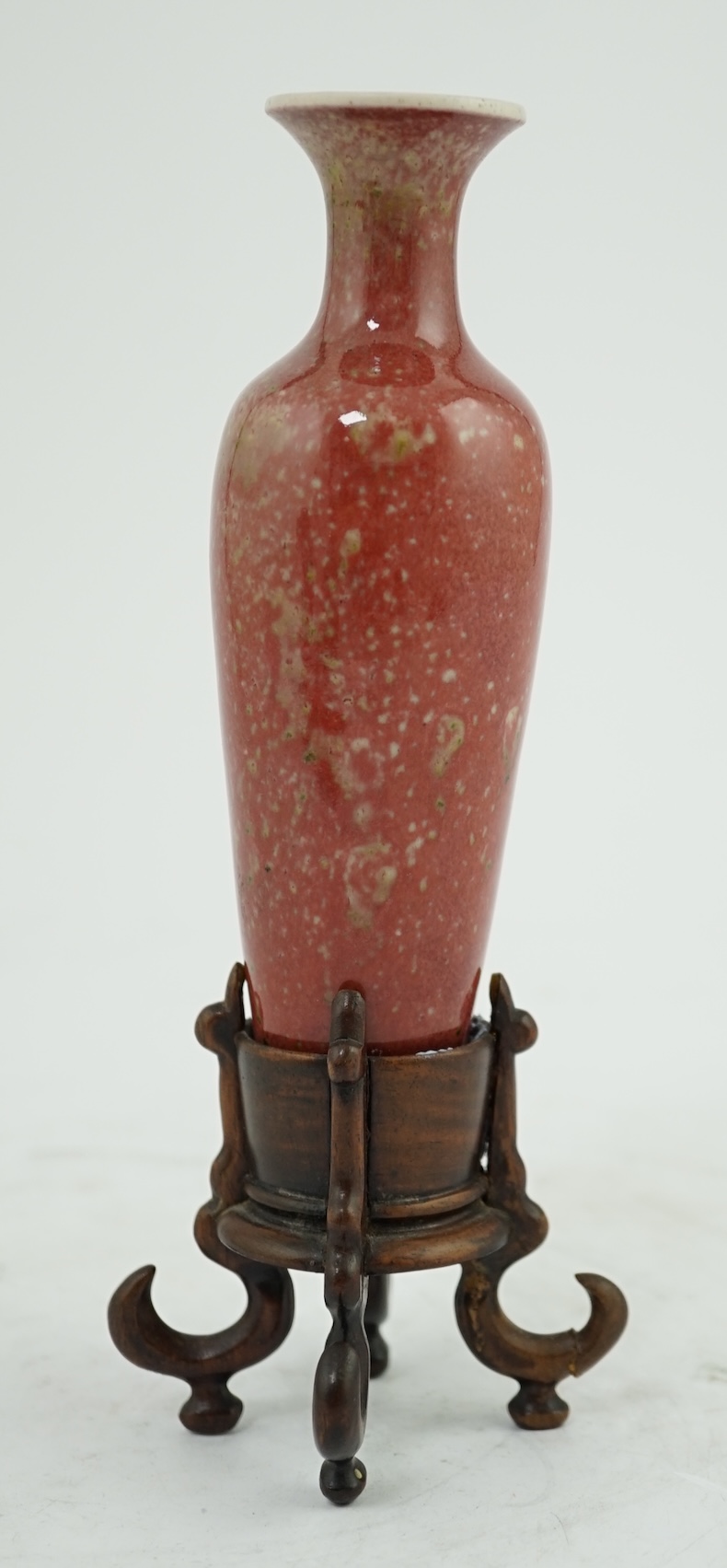 A small Chinese peach bloom glazed vase with fitted wood stand, Republic period